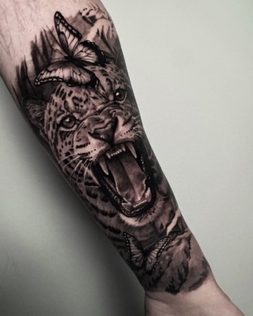 Jaguar anf jungle tattoo